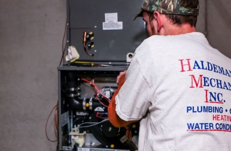 Haldeman Mechanical electrician working on wiring.