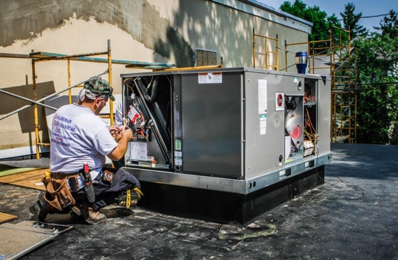 Technician working on a HVAC unit.