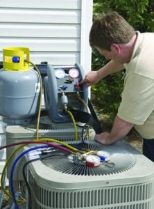 Man repairing AC unit.