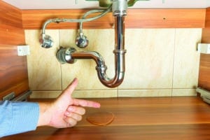 flood under drain of sink in bathroom