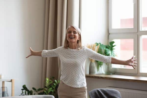 Woman in home breathing clean air.