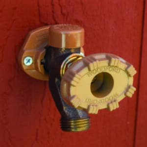 Wall-mounted Woodford Model 19 anti-burst outdoor faucet with a frost-free design and pressure relief valve.